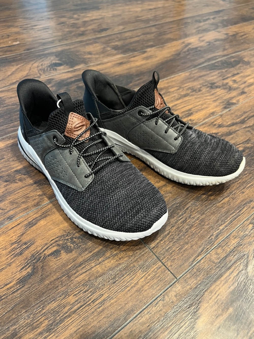 Skechers Black Knit Athletic Sneakers with White Sole and Brown Accent